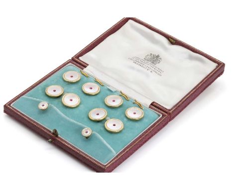 A cased set of 9ct gold and mother of pearl dress studs, comprising four buttons with removable clips, a pair of cufflinks an