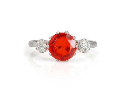 An 18ct white gold fire opal and diamond ring,  with a central round cut fire opal, 9.00mm in diameter, flanked by two round 