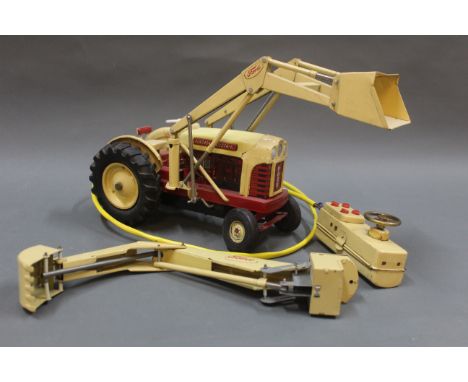 A Cragstan Corporation Ford 4040 metal tractor, with remote control.