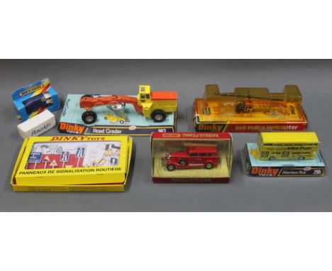 A group lot of Dinky and Matchbox diecast model toys: A Dinky Bell Police Helicopter (732), a Dinky Road Grader (963), a Dink