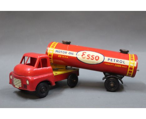 A Wells Brimtoy (UK) articulated Esso petrol tanker, comprising a tin plate and plastic Bedford type cab, with matching Esso 