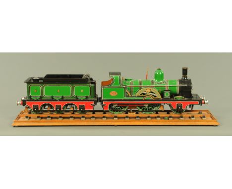 A cased scale model of the TW Worsdell NER Class 902 2-4-0 steam locomotive and tender.  The locomotive modelled by N Downing