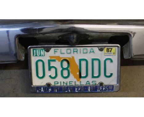 Automobilia:- A Vintage 1980's American car bumper, having a Florida Pinellas registration plate, measuring a total length of