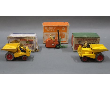 A group of three boxed Dinky construction vehicles:- A 562 dumper truck in green box, a 14C Coventry Climax fork lift truck i