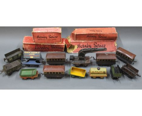 A box of 0 gauge rolling stock, to include Hornby Series Pullman coaches, and other wagons