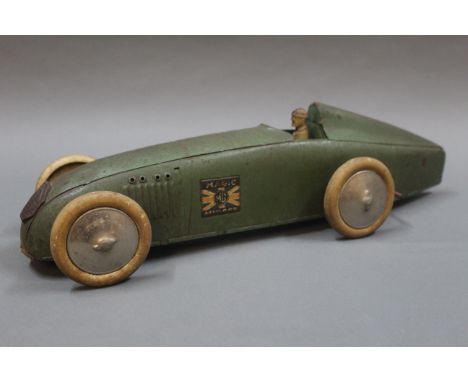A 1930's Triang Lines Bros. Magic Midget record car, in green with painted driver, Union Jack "Magic MG Midget" plates to the