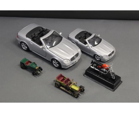 A box of diecast, to include large scale cars. 