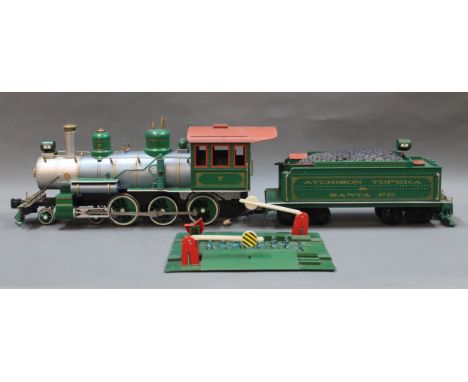 A Bachmann's Big Hauler R/C receiver locomotive, wagon and level crossing.