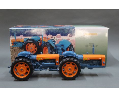 A boxed Universal Hobbies 1:16 scale model of a Ford Doe "Triple D" tractor, with original box.