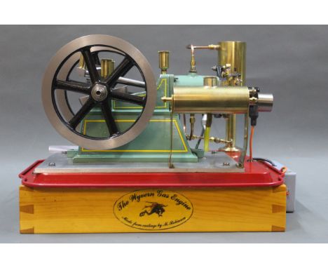 A Wyvern four stroke petrol engine, water cooled, built from castings, complete with 6 volt electronic spark ignition, and in