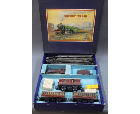 A Hornby 0 gauge clockwork No.501 passenger set, comprising a Type 501 0-4-0 LMS 5600 clockwork loco, tender, 3 LMS coaches a