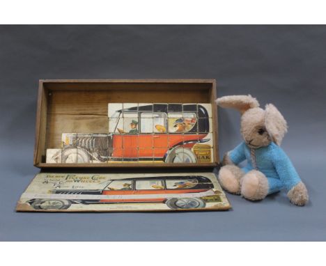 A Steiff bunny rabbit, with metal button to the ear, together with a J.A.K "The New Picture Cube On Wheels" building block ga