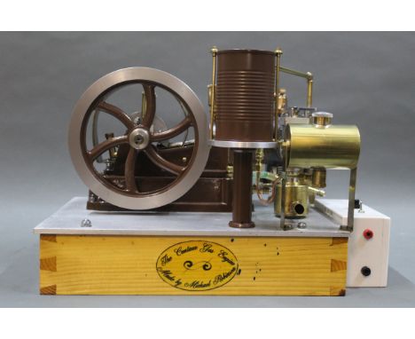 A Centaur four stroke petrol engine, with water cooling circulating pump, built from castings, complete with 6 volt electroni