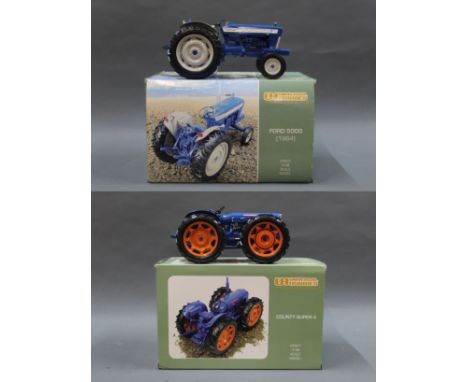 Two boxed Universal Hobbies 1:16 scale model tractors, comprising a "County Super 4" tractor and a "Ford 5000 (1964)".