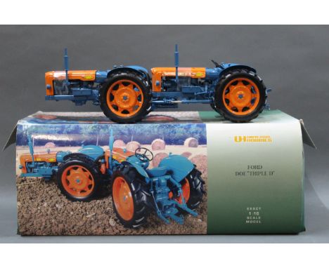 A boxed Universal Hobbies 1:16 scale model of a Ford Doe "Triple D" tractor.