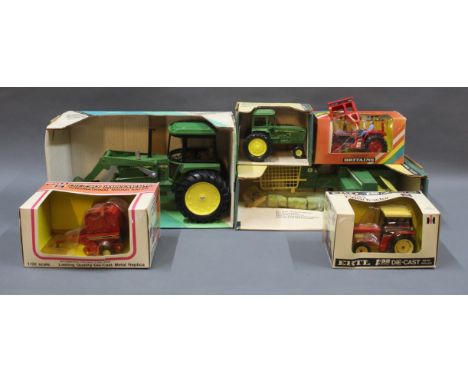 A group of 6 Britain's and Ertl agricultural diecast model vehicles:- A John Deere baler, a John Deere sound-idea tractor wit