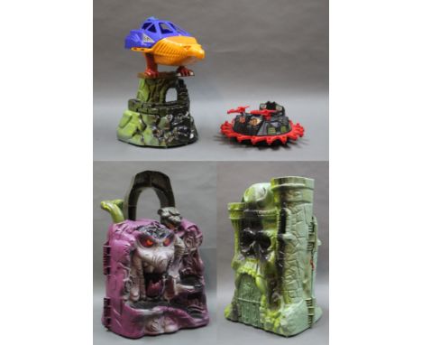 A Mattel Master's of The Universe Castle Grayskull Fortress, a Skeletor Snake Mountain playset, both with accessories, a Mast