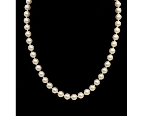 A cultured and 18ct gold single row necklace, comprising uniform pearls approx 8mm, with a diamond set white gold ball clasp,