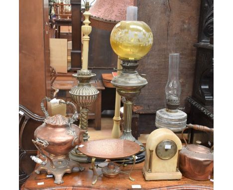 Three 19th century oil lamps; two copper kettles with stands; and an early 20th century Marie mantel clock.