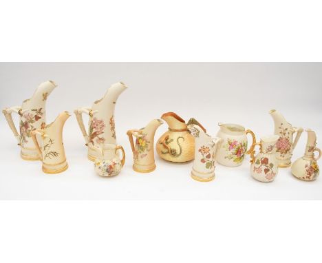 Royal Worcester - A collection of eleven blush ivory ceramic jugs to include various sizes from 8.5cm to 26.5cm high. Various