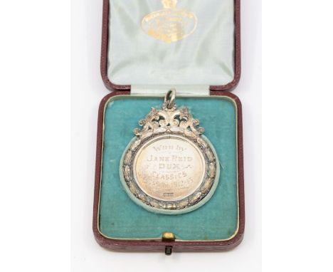 A George V Scottish silver medal, within wreath framing, engraved inscription dated 1912-13., hallmarked RLC only for R L Chr