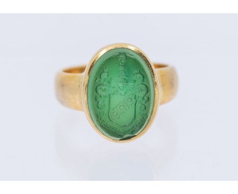 A late Victorian 22 carat gold hardstone seal ring, comprising a green agate, with intaglio carved cote of arms, width approx