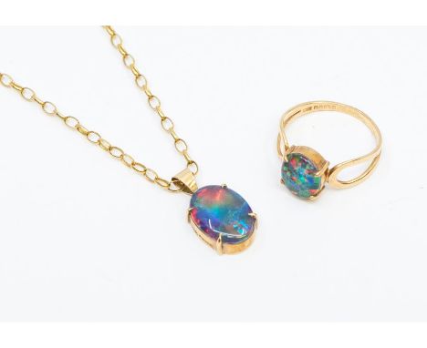 A 9ct gold mounted pendant and chain set with a tripelt opal, along with a matching opal triplet ring, size O1/2, combined to