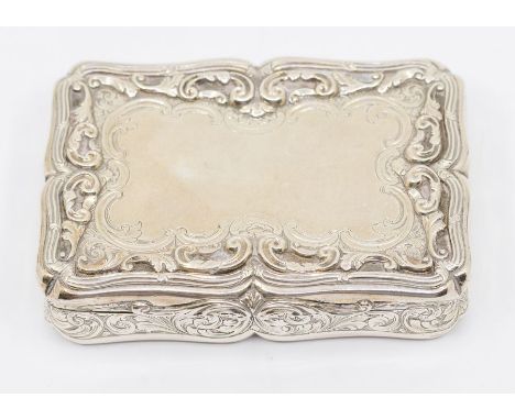 A Victorian silver snuff box, the cover with chased and engraved ornate scrolling border in high relief, the sides and base e