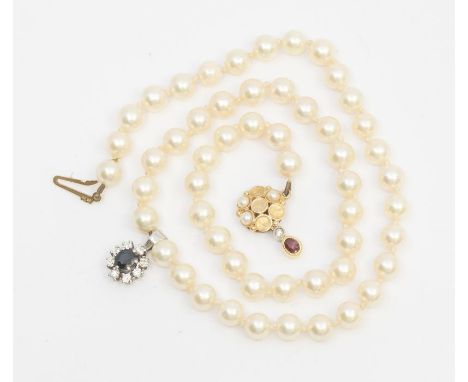 A cultured pearl necklace, comprising uniform pearls each approx 6mm, length approx 60cm, suspending a sapphire and diamond w