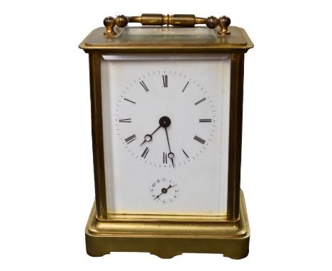 A French brass carriage clock with enamel dial, clear glass viewing panels, signed 'Aiguilles' to the back plate. Key present