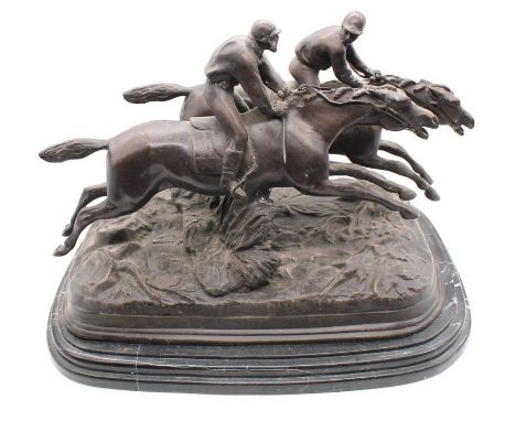 A large bronze figure of two Jocky's racing horses on marble stands, French maker, early 20th century, signed.