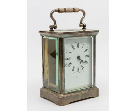 French carriage clock with white porcelain dial,  Roman numerals and a unreadable name on the dial followed by Paris. A silve