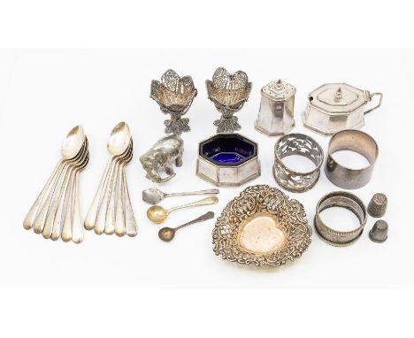 A collection of silver to include; an Art Deco period condiment set to include mustard pot with blue glass liner, a salt cell