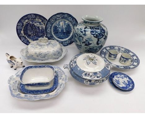 A collection of various blue and white ceramics to include; tureens and cover, plates, a large vase, cow shaped candle holder