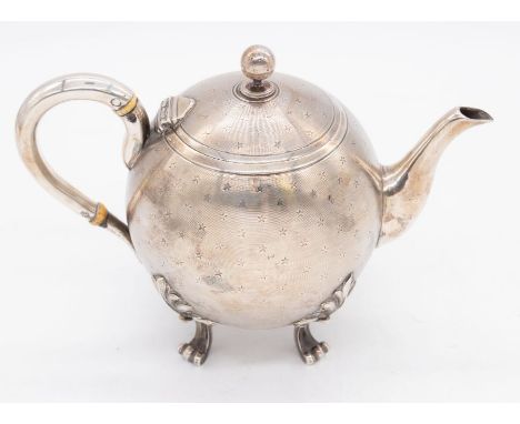 A 20th Century French silver globular shaped teapot with engraved linear and star decoration to body, on four anthemion and s