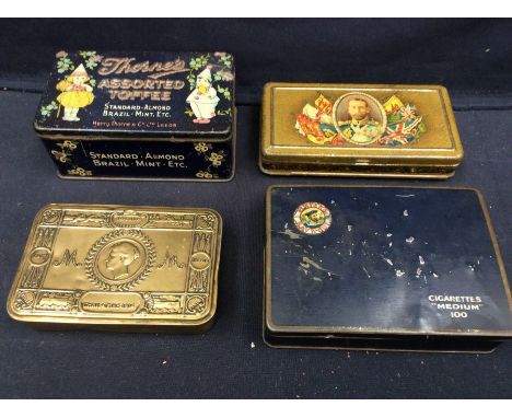 A collection of early 20th century tins including World War I Christmas 1914 tin, early Rowntree's tin with postcards behind 