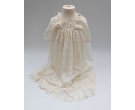 A good collection of a child's christening set dating from c.1910-18. The set includes: silk christening dress with faggoting