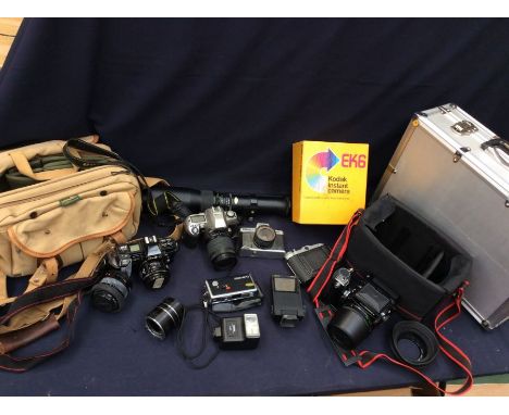 A collection of camera equipment to include a Zenza Bronica camera with case and spares.Suitcase set of camera equipment by R