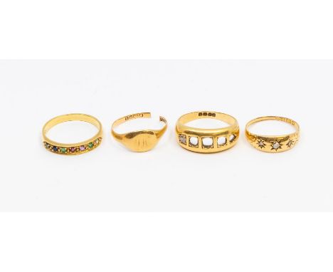 A collection of four 18ct gold rings, comprising a Dearest ring, set diamond, emerald, amethyst, ruby, emerald, sapphire, tou