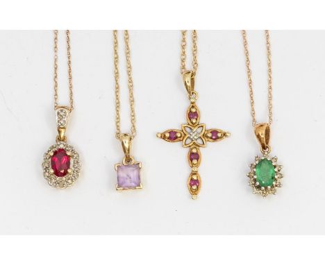 A collection of 9ct gold pendants with chains to include a diamond and ruby set cross, an oval emerald and diamond cluster pe