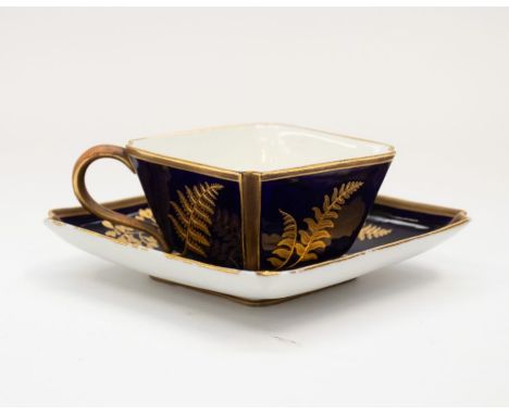 Royal Worcester - A cobalt and gilt aesthetic movement cup and saucer, decorated with foliage, factory mark and date mark 187