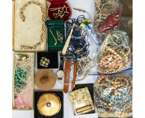 A collection of costume jewellery to include a silver and marcasite brooch, silver pendant with mother of pearl carved flower