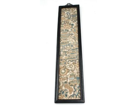 A 19th Century Asian crewel work panel depicting vases of flowers on tables, ribbon tied motifs, flowers and foliage, in ebon