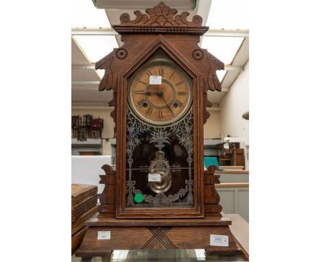 An early 20th century American 'Cookie'/ 'Gingerbread' clock, two treen trinket boxes and a table lamp