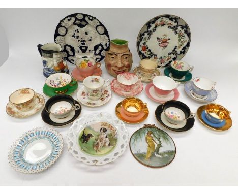 A large collection of decorative china plates, including 18th century Chinese export, character mugs, decorative cups and sau