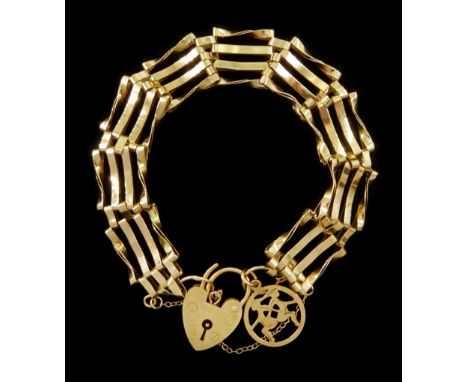 9ct gold four bar gate bracelet, with heart locket clasp, hallmarkedCondition Report:Approx 9.9gm, some links wearing thin