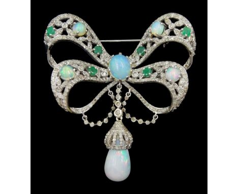 Silver opal, emerald and diamond bow brooch, suspending a pear cut opal and diamond pendant drop, total opal weight approx 4.