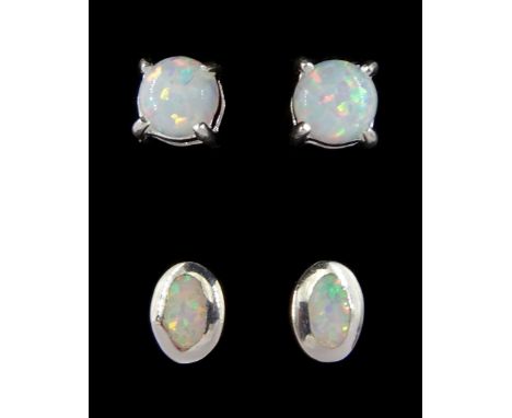 Two pairs of silver opal stud earringsCondition Report:Max length = 7mm, good condition