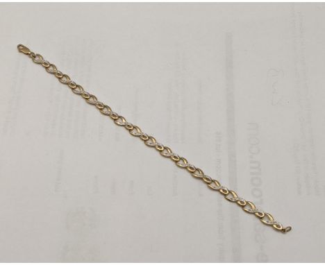 A 9ct gold and diamond infinity loop bracelet total weight 4.6gLocation: 