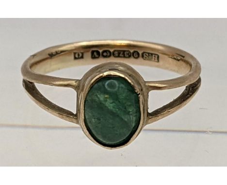 A 9ct gold ring inset with an oval cut jade cabochon 2.3gLocation: 